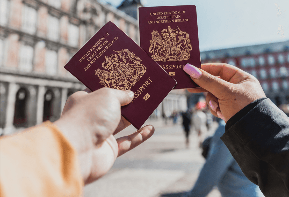 British Passports in a Sunlit Plaza