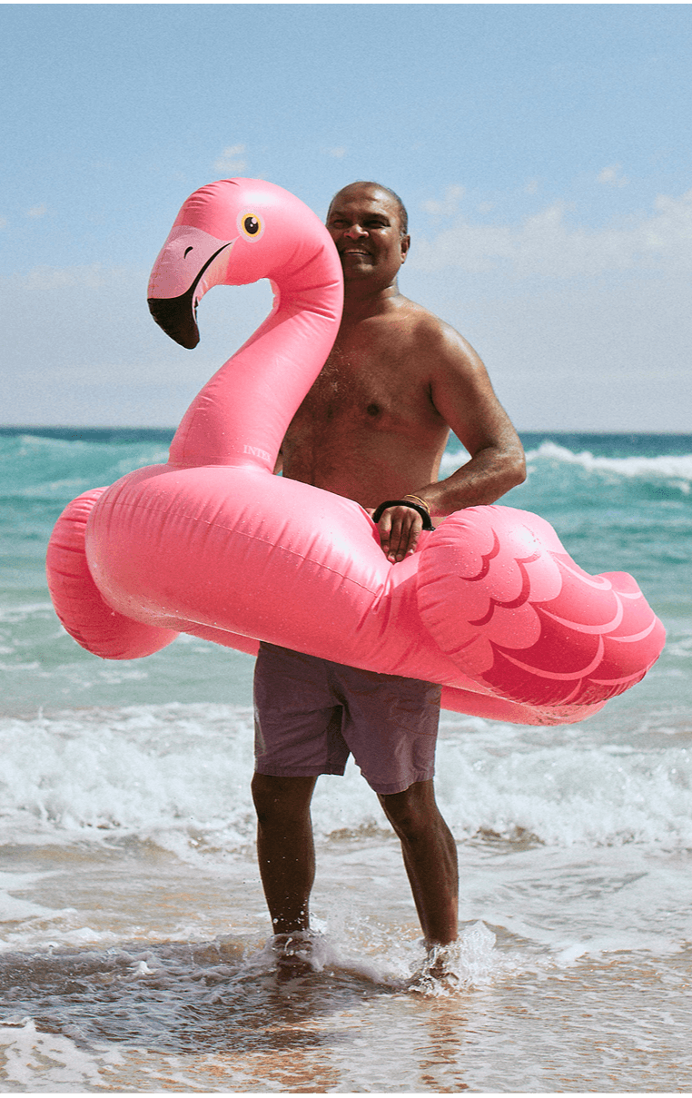 Day_03_STAYSURE_STILLS_Beach_Man_Flamingo_01_1367 1.png